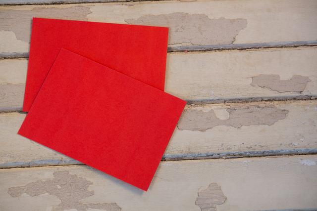 Red envelopes on wooden plank during christmas time