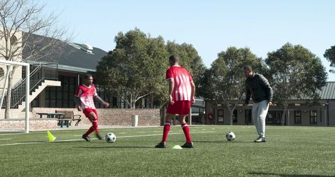 Youth soccer players practicing each day beyond the field, receiving skillful guidance