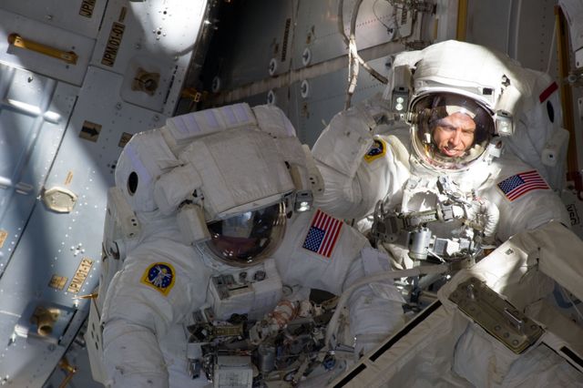 S134-E-008966 (25 May 2011) --- With components of the International Space Station in the view, NASA astronauts Andrew Feustel (right) and Michael Fincke are pictured during the STS-134 mission?s third spacewalk. The two mission specialists coordinated their shared activity with NASA astronaut Greg Chamitoff (out of frame), who stayed in communication with the pair and with Mission Control Center in Houston from the shirt sleeve environment inside the ISS. Photo credit: NASA