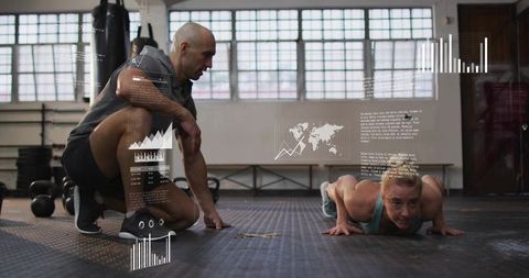 Trainer coaching woman performing push-ups with augmented reality fitness data overlay