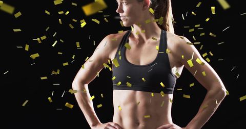 Celebrating triumph: female athlete with golden confetti