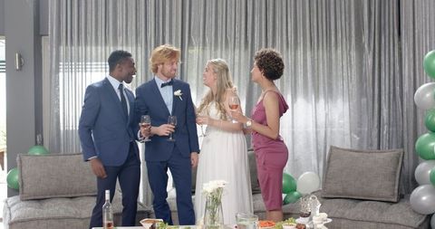 Joyful Wedding Reception Celebration with Friends Toasting