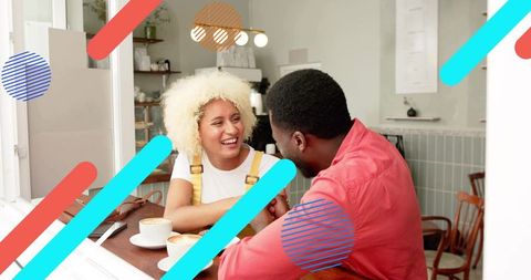 Cheerful Couple Enjoying Coffee at Urban Cafe