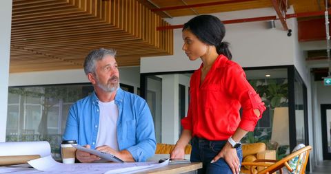 Team discussion in modern creative office environment