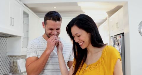 Happy Couple Laughing in Kitchen Setting - Download Free Stock Images Pikwizard.com