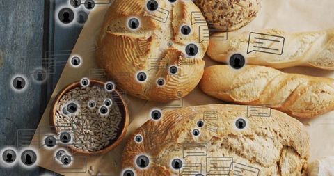 Assortment of artisan breads on rustic table with seed bowl and social media overlay icons