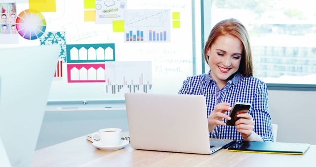 Young Woman Working on Laptop and Phone in Bright Office - Download Free Stock Images Pikwizard.com