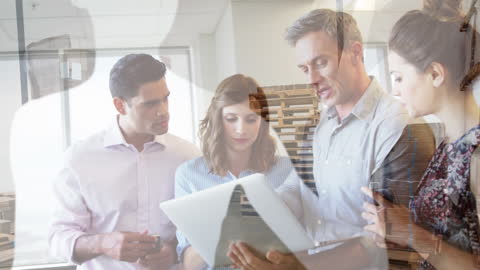 Team of Professionals Analyzing Data Over Business Visualization