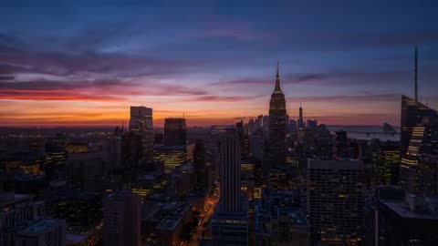 Sunset Timelapse Over Manhattan Skyline Showing Empire State Building Lighting Up