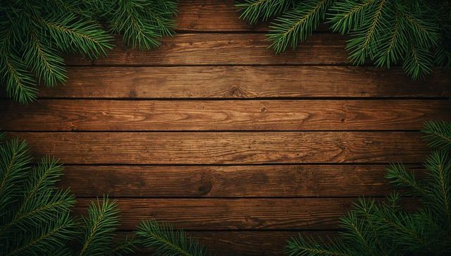 Rustic Wooden Planks with Evergreen Branch Frame and Seasonal Decor