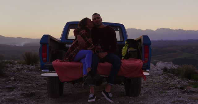 Couple Sitting in Truck Bed Enjoying Sunset in Countryside - Download Free Stock Images Pikwizard.com