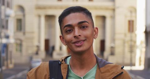 Biracial Man Smiling on Urban Street Minationing Explorer Travel