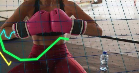 Female Boxer Clasping Fists and Training in Ring with Pink Gloves and Neon Data Overlay