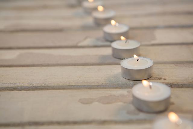 Burning Candles on Wooden Plank During Christmas Time - Download Free Stock Photos Pikwizard.com