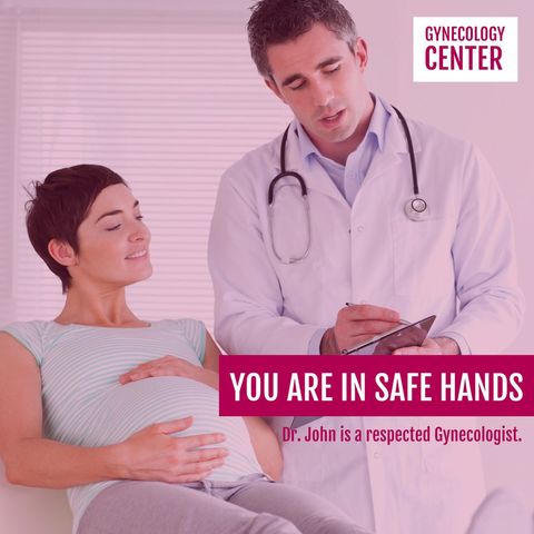 Professional gynecologist consulting pregnant woman with care