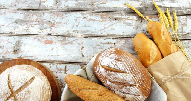 Assorted Artisan Bread on Rustic Wooden Table - Download Free Stock Images Pikwizard.com