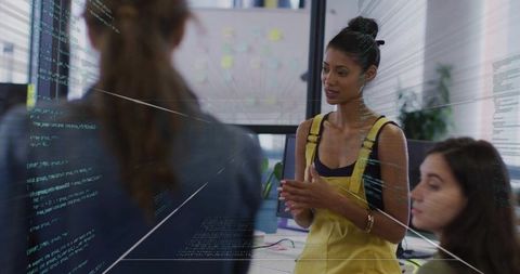 Software engineer leading team presentation in modern workspace