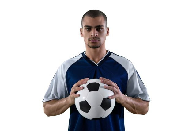 Football player holding football with both hands against white background