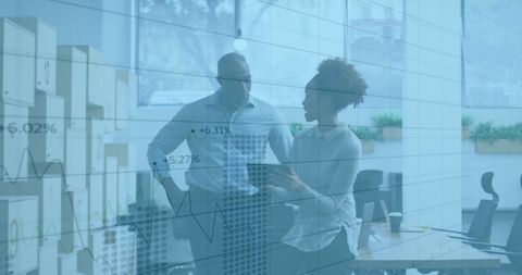 Business Professionals Analyzing Financial Data Charts in Office