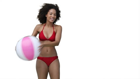 Woman Enjoying Beachball Exercise in Red Bikini