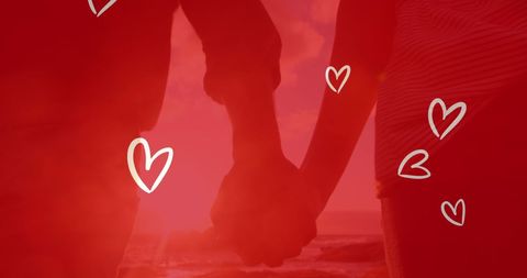 Romantic Couple Holding Hands at Beach Sunset with Hearts