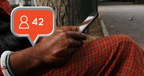 Elderly man engaging on smartphone in a park with growing follower count - Download Free Stock Images Pikwizard.com