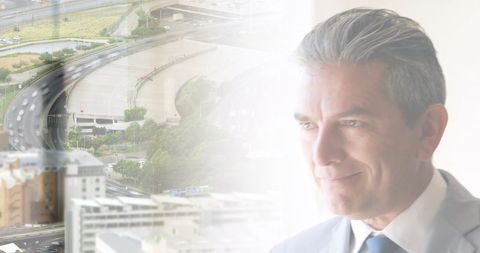 Businessman in Office Overlooking Blended Urban Cityscape