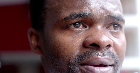 Close-up depicting intense emotion of sweaty man