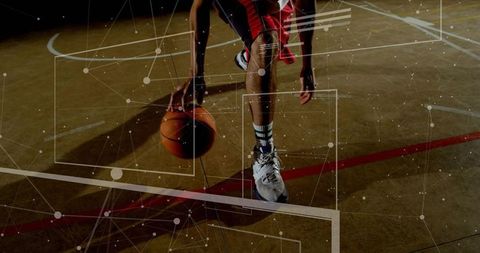 Dynamic Basketball Player Dribbling on Court with Technology Overlay