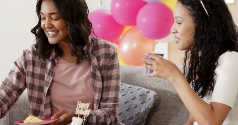 Friends Celebrating Birthday with Cake and Snacks