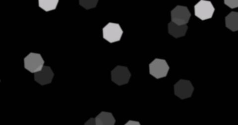 Floating blurred octagonal shapes on dark background creating abstract art