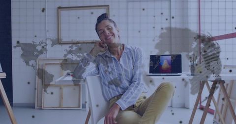 Creative entrepreneur smiling in bright art studio