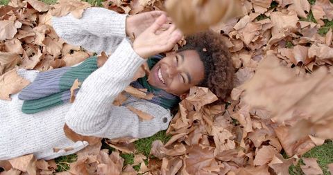 Joyful Boy Playing in Autumn Leaves Outdoors - Download Free Stock Images Pikwizard.com