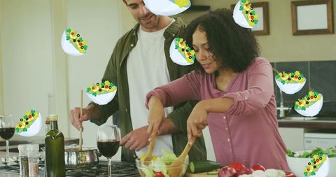 Happy Couple Cooking Together with Salad Icons