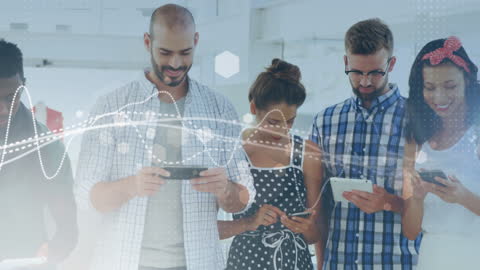 Diverse Team Engaging with Digital Technology in Modern Workspace