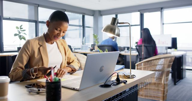 Young Professional Woman Working in Modern Office Environment - Download Free Stock Images Pikwizard.com