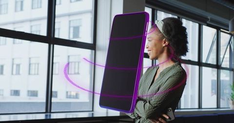 Professional woman using innovative smartphone hologram technology