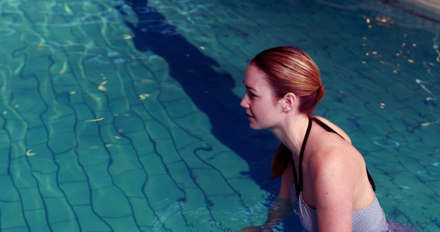 Woman Enjoying Relaxing Time in Swimming Pool - Download Free Stock Images Pikwizard.com