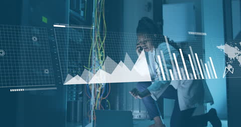 African American IT Professional Analyzing Data in Server Room