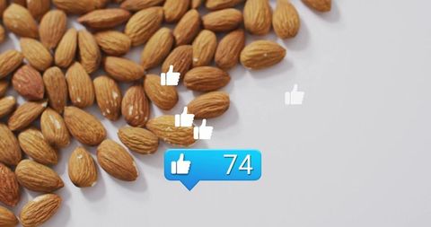 Almonds with Social Media Likes Counter on White Surface
