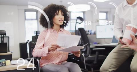 Diverse Team with Financial Data Overlay in Modern Office