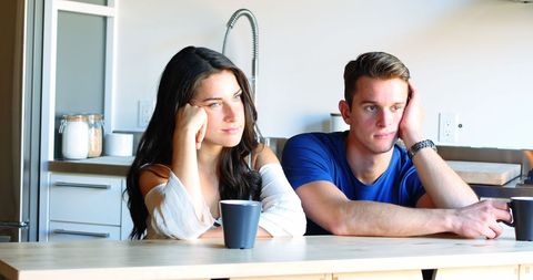 Thoughtful Couple Contemplating in Modern Kitchen - Download Free Stock Images Pikwizard.com