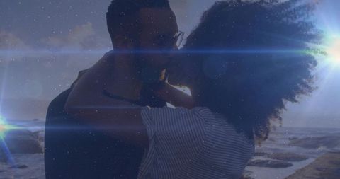 Romantic Beach Sunset with Embracing Couple Silhouette