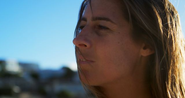 Thoughtful Woman Outdoors with Sunny Sky Background - Download Free Stock Images Pikwizard.com