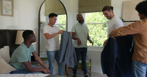 Group of friends preparing for wedding day in bedroom