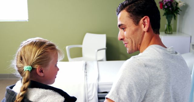 Father Comforting Daughter at Medical Clinic - Download Free Stock Images Pikwizard.com