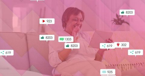 Mature Woman Engaging with Tablet Displaying Social Metrics