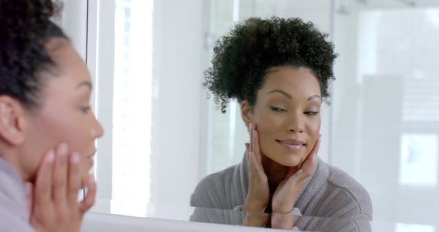 Woman Admiring Reflection in Bathroom Mirror - Download Free Stock Images Pikwizard.com