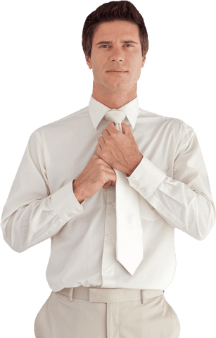Confident businessman adjusting tie in transparent office environment