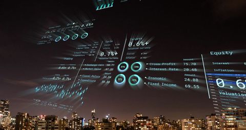 Digital Overlay of Financial Data on Cityscape at Night